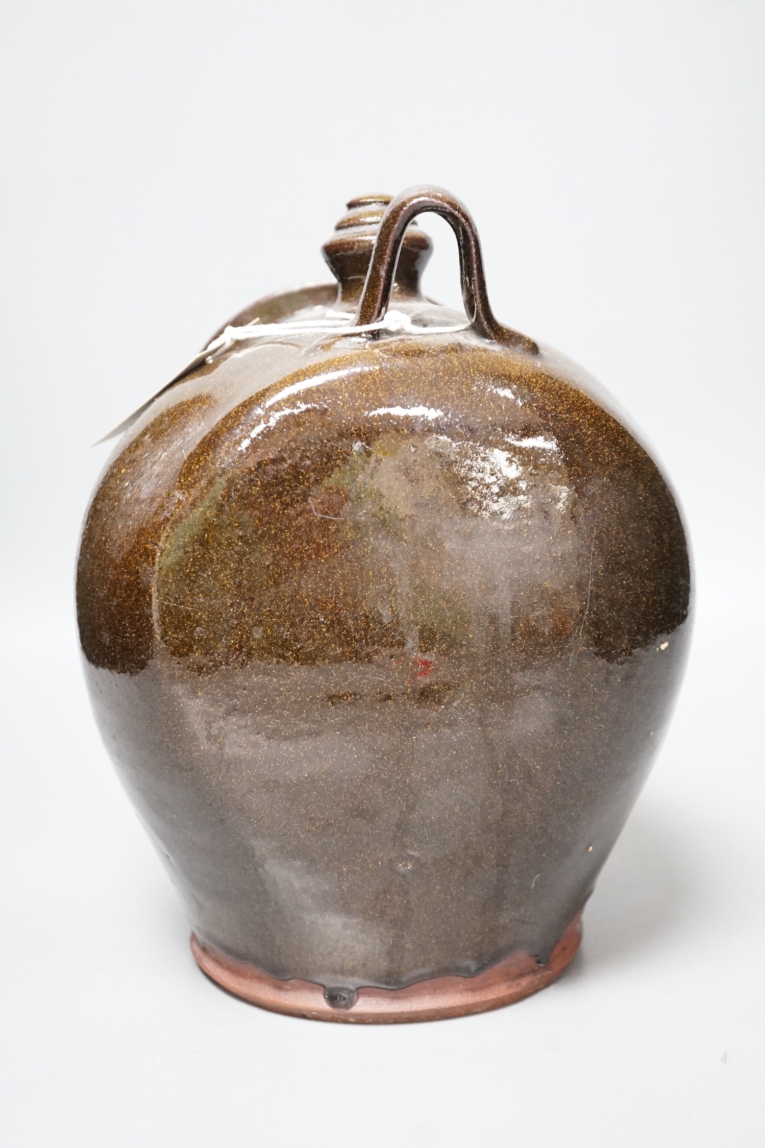 A glazed stoneware salt dispenser, inscribed in slip Mrs Barbour 9th Decr. 1879, 25cm